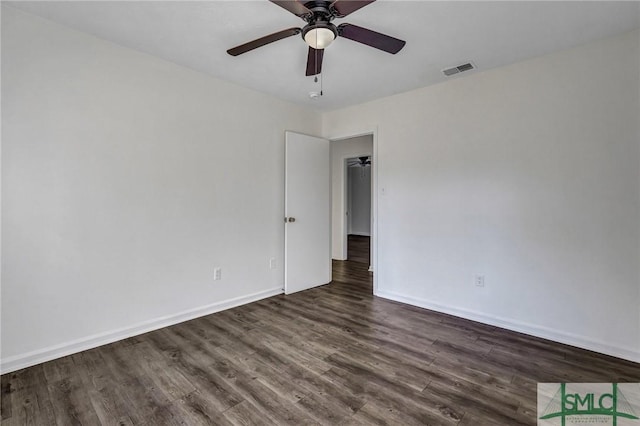 unfurnished room with dark hardwood / wood-style flooring and ceiling fan