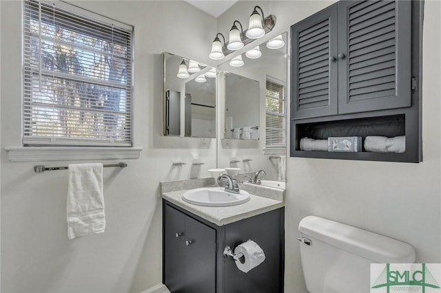 bathroom featuring vanity and toilet