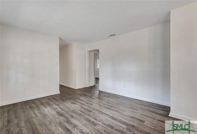 empty room featuring wood-type flooring