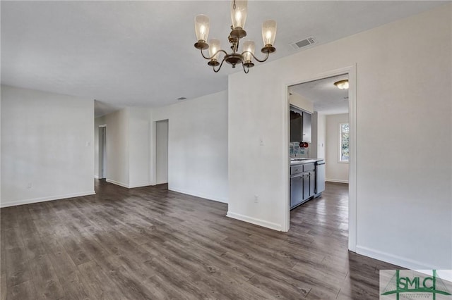 interior space with dark hardwood / wood-style flooring and a notable chandelier