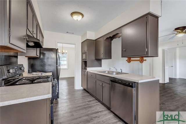 kitchen featuring black electric range, dishwasher, sink, and light hardwood / wood-style flooring