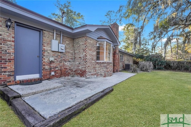 exterior space with cooling unit and a patio area