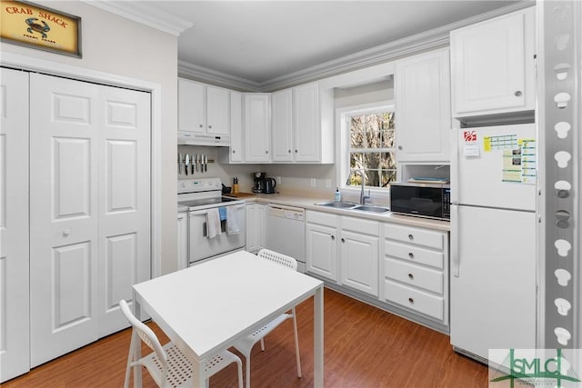 kitchen featuring white cabinetry, sink, white appliances, and light wood-type flooring