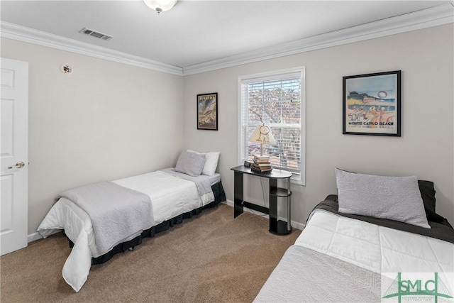 bedroom with ornamental molding and carpet flooring