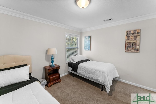 bedroom featuring crown molding and carpet