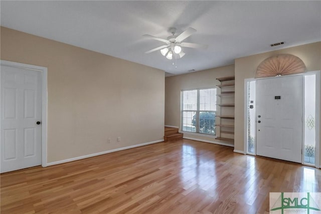 foyer entrance featuring ceiling fan and light hardwood / wood-style floors