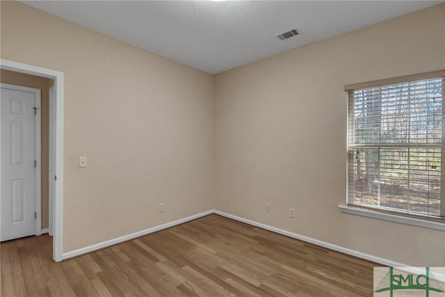 empty room featuring wood-type flooring