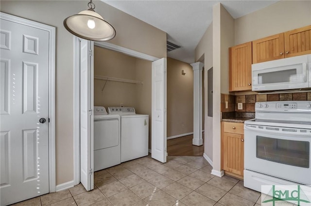 kitchen with ornate columns, light tile patterned floors, light brown cabinetry, and white appliances