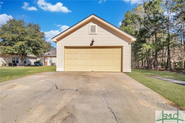 garage with a lawn