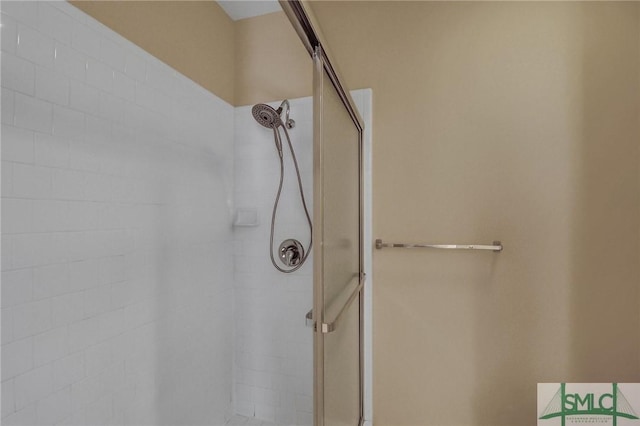 bathroom with a tile shower