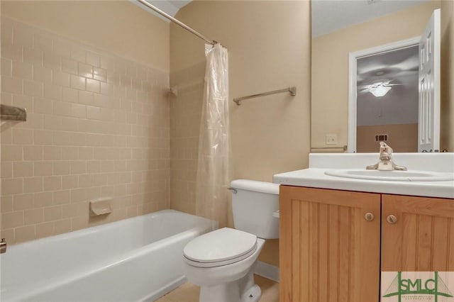 full bathroom with vanity, shower / bath combination with curtain, and toilet