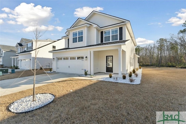 view of front of house with a garage and covered porch