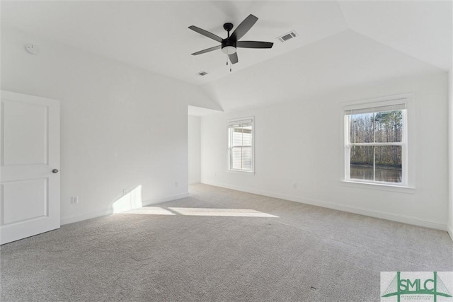 unfurnished room featuring lofted ceiling, light colored carpet, and ceiling fan