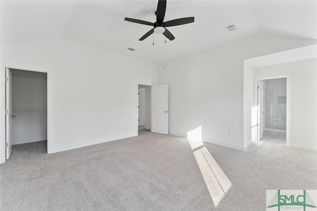 unfurnished room featuring lofted ceiling, light colored carpet, and ceiling fan