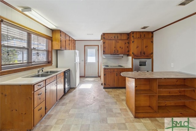 kitchen with crown molding, sink, and black appliances