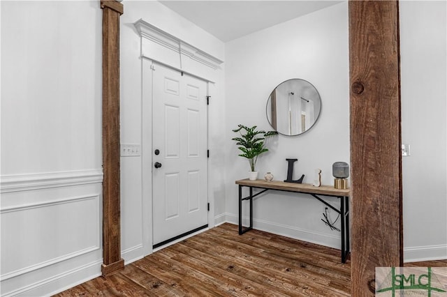 foyer entrance with dark wood-type flooring