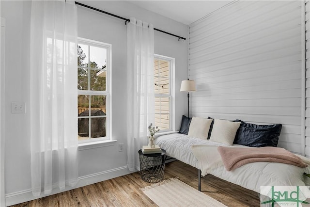 bedroom with hardwood / wood-style flooring