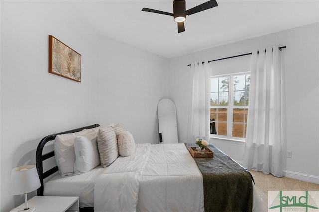 carpeted bedroom with ceiling fan