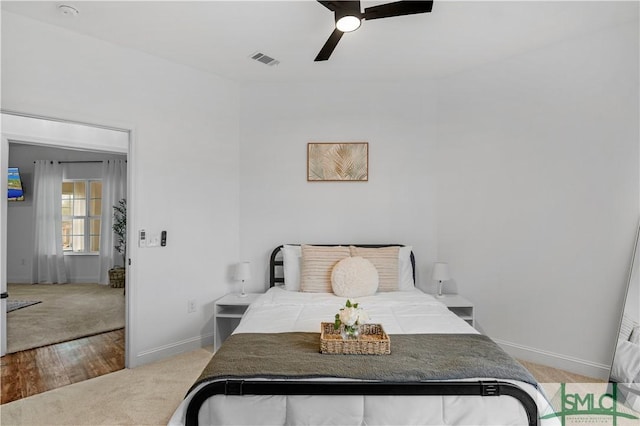 carpeted bedroom with ceiling fan