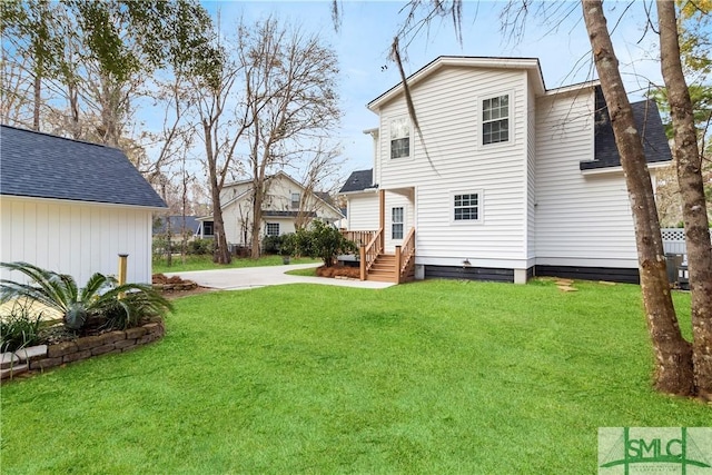 back of house featuring a yard