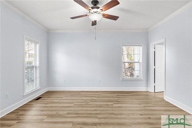 spare room featuring ceiling fan, ornamental molding, light hardwood / wood-style flooring, and a textured ceiling