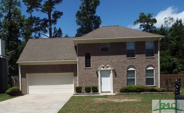 colonial-style house with a garage and a front lawn