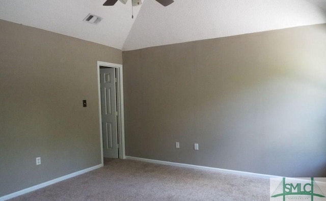 unfurnished room featuring lofted ceiling, carpet, and ceiling fan