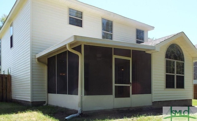 back of house with a sunroom