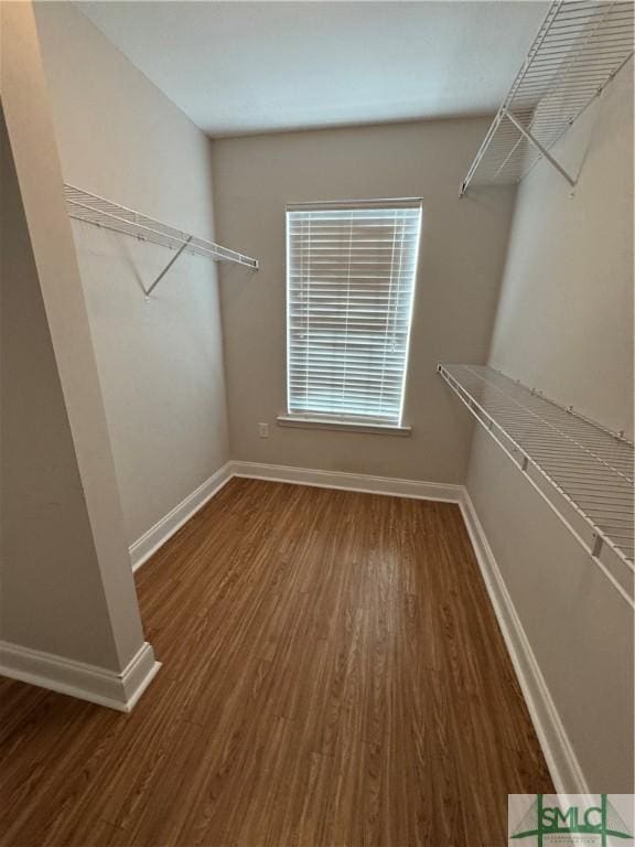 709 Eden Ln, Hinesville, GA 31313 - spacious closet featuring dark wood-style floors