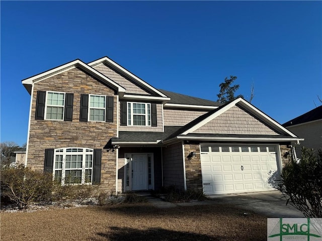 view of front of property featuring stone siding, an attached garage, and concrete driveway