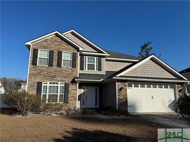 view of front of home featuring a garage, stone siding, and driveway