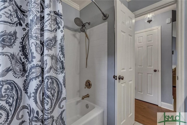 bathroom featuring hardwood / wood-style flooring, ornamental molding, and shower / bath combo with shower curtain