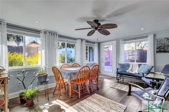 sunroom / solarium with ceiling fan and a healthy amount of sunlight