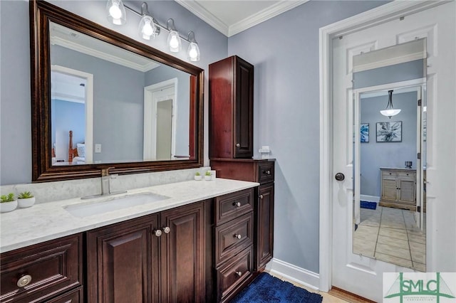 bathroom featuring vanity and ornamental molding