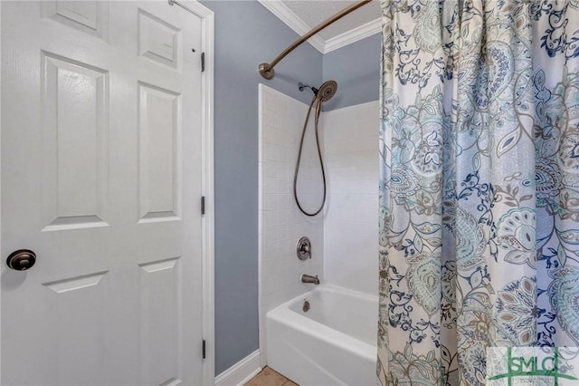 bathroom featuring ornamental molding and shower / bathtub combination with curtain