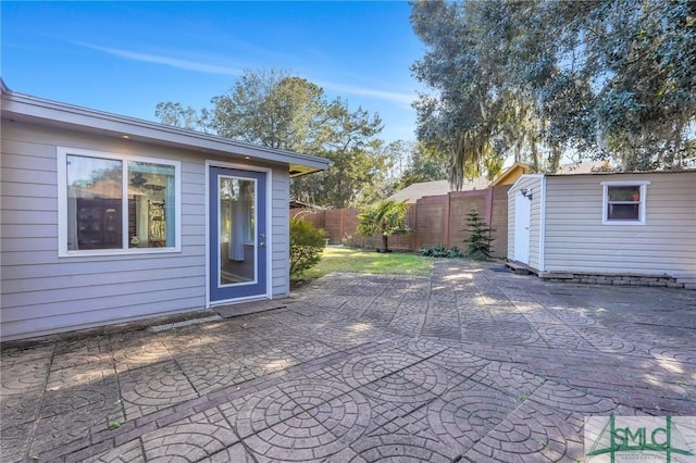 view of patio / terrace featuring a storage shed