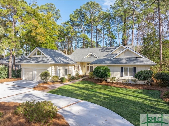 view of front of property with a garage and a front yard