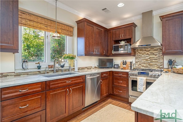 kitchen featuring sink, stainless steel appliances, crown molding, light stone countertops, and wall chimney exhaust hood