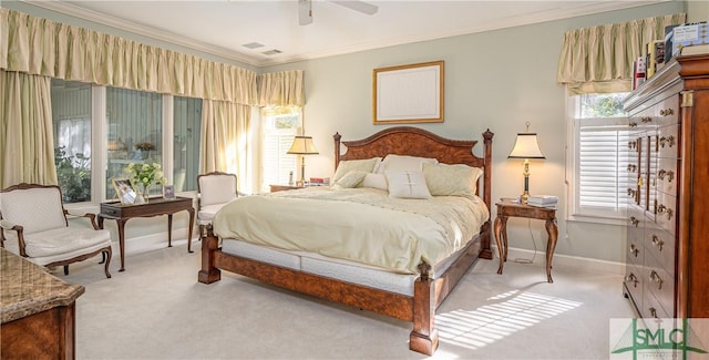 bedroom with multiple windows and crown molding