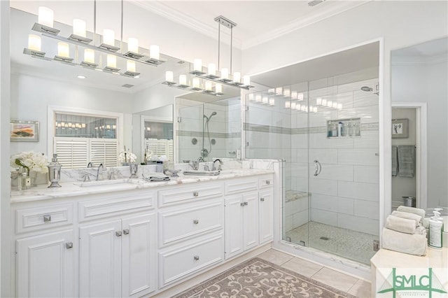 bathroom with ornamental molding, an enclosed shower, tile patterned flooring, and vanity