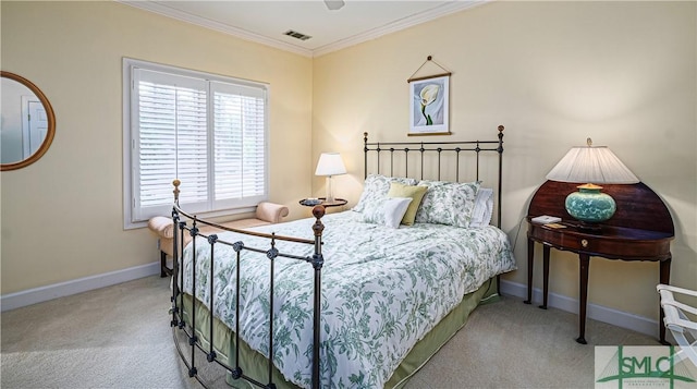 bedroom with ornamental molding and carpet