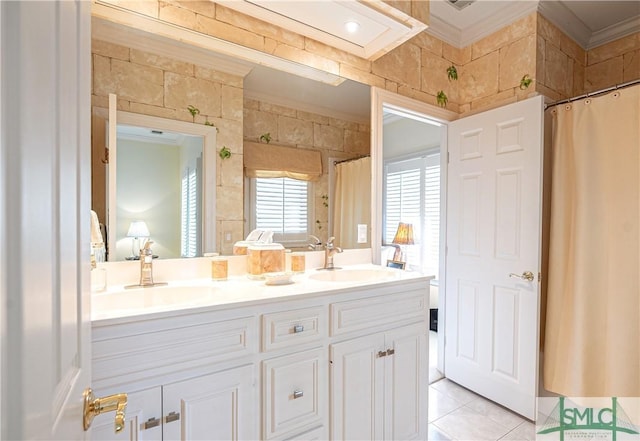 bathroom with tile patterned flooring, vanity, and ornamental molding