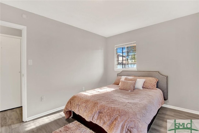 bedroom with hardwood / wood-style flooring