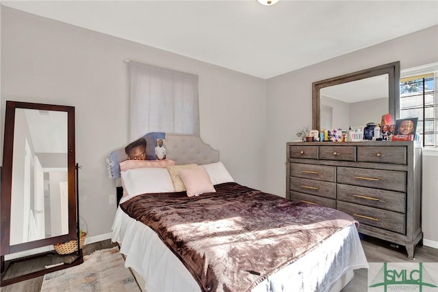 bedroom with light hardwood / wood-style floors