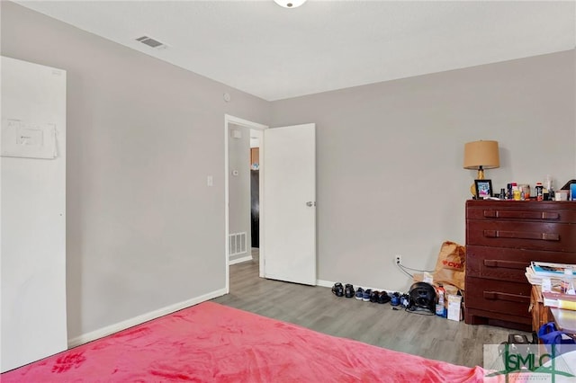 bedroom with light hardwood / wood-style flooring