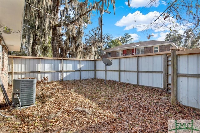 view of yard featuring central air condition unit