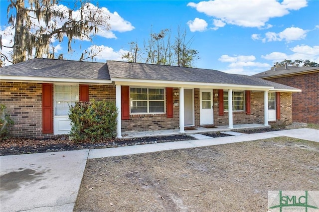 ranch-style house with covered porch