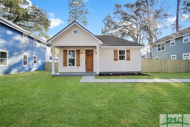 bungalow featuring a porch and a front lawn