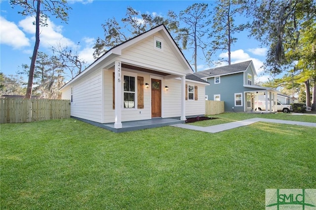 view of front of house with a front lawn and covered porch