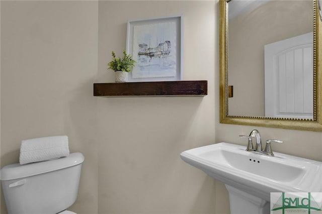 bathroom with sink and toilet